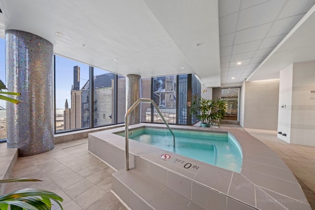 view of pool featuring an indoor hot tub