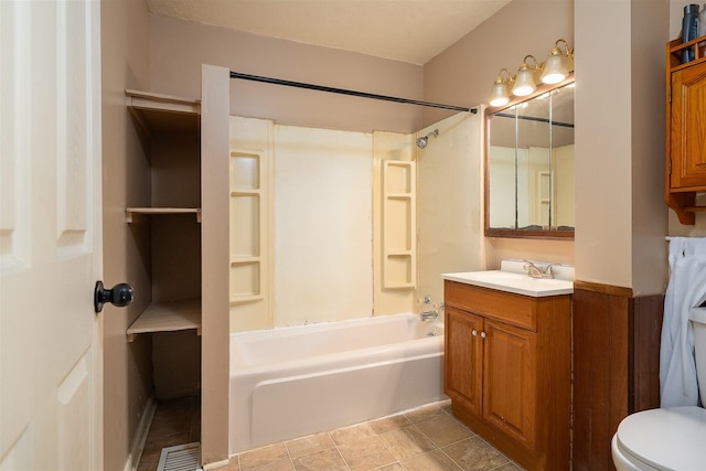 full bathroom with toilet, tile patterned flooring, vanity, and washtub / shower combination