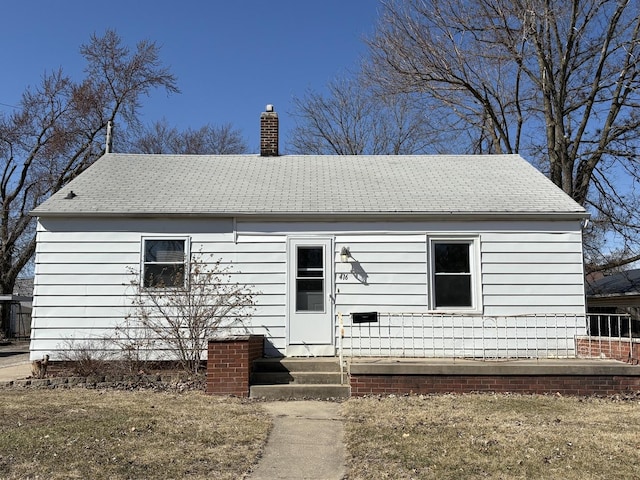 view of front of property featuring a chimney