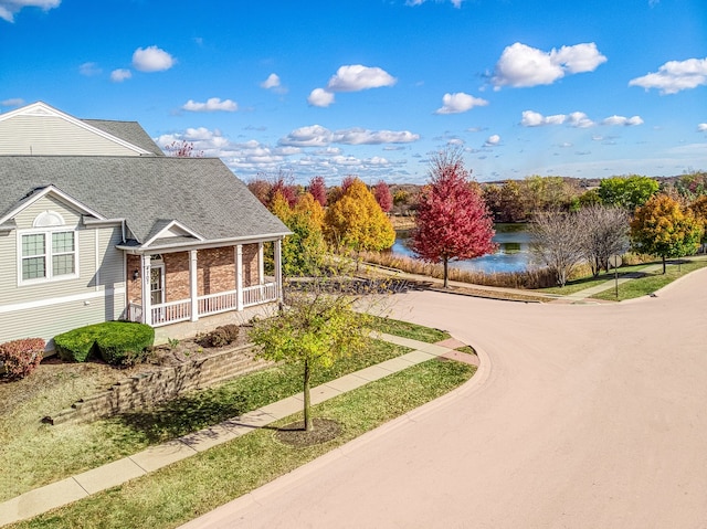 surrounding community with a water view