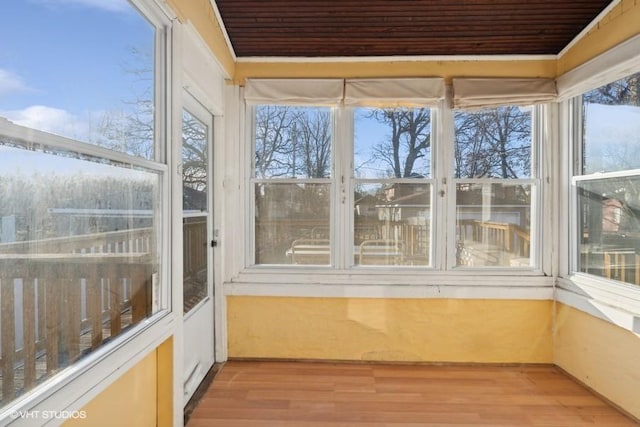 unfurnished sunroom featuring a wealth of natural light