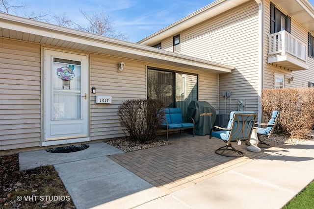 doorway to property with a patio