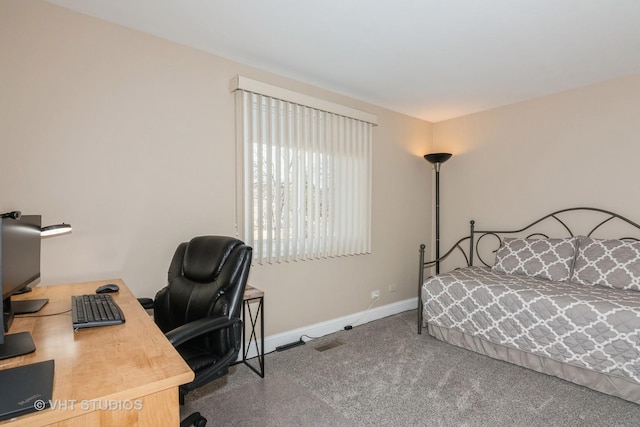 carpeted bedroom featuring visible vents and baseboards