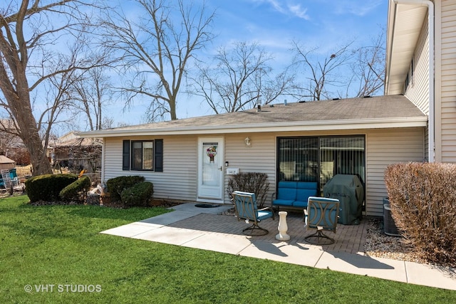 exterior space with a patio and a front yard