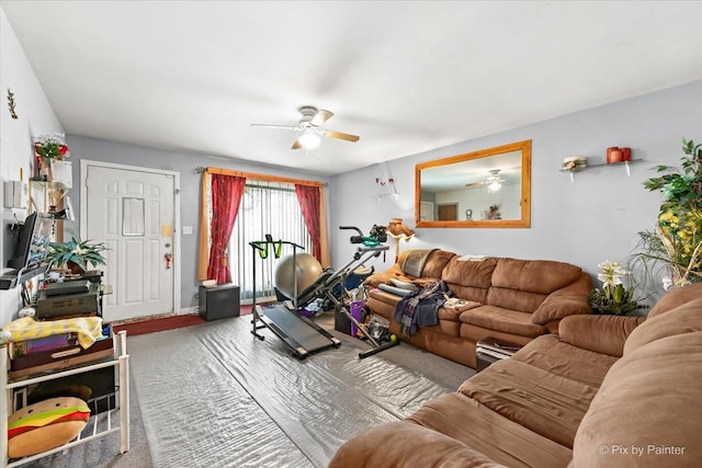 living area featuring carpet and a ceiling fan