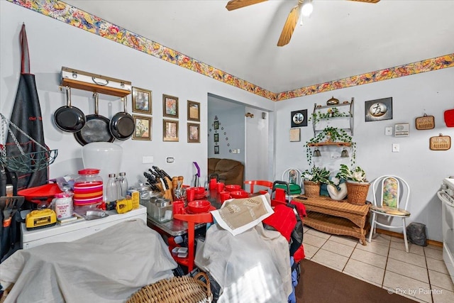 tiled dining space with ceiling fan