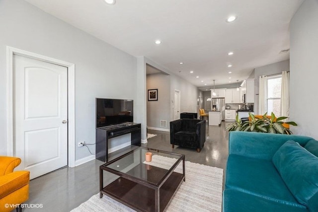 4904 W Fulton St, Chicago, IL 60644 - living room with recessed lighting and baseboards