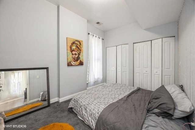 4904 W Fulton St, Chicago, IL 60644 - carpeted bedroom featuring two closets and baseboards