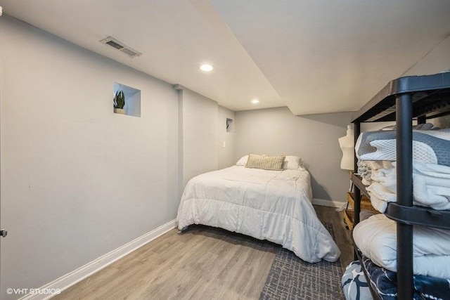 4904 W Fulton St, Chicago, IL 60644 - bedroom featuring wood finished floors, baseboards, and recessed lighting