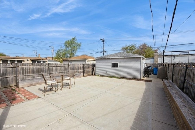 4904 W Fulton St, Chicago, IL 60644 - fenced backyard with a patio and an outbuilding