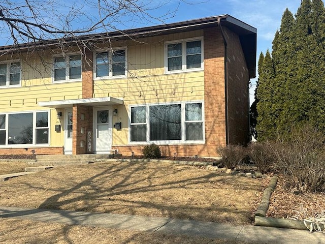 view of front of home featuring brick siding