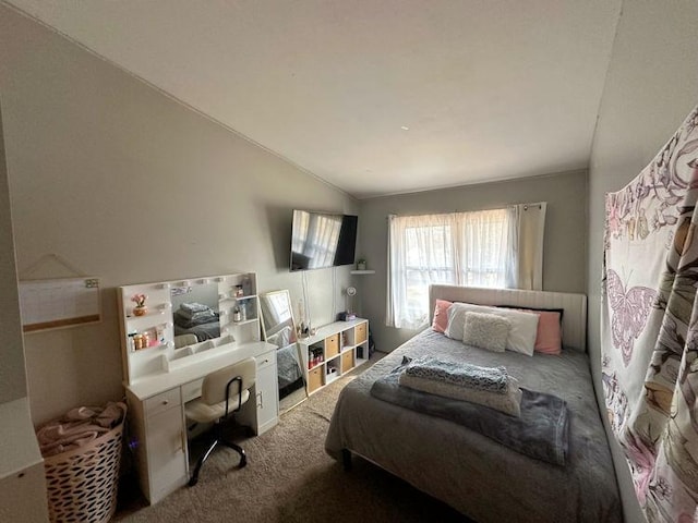 carpeted bedroom with lofted ceiling