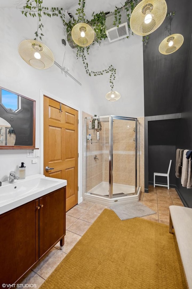 bathroom featuring a shower stall, vanity, and tile patterned floors