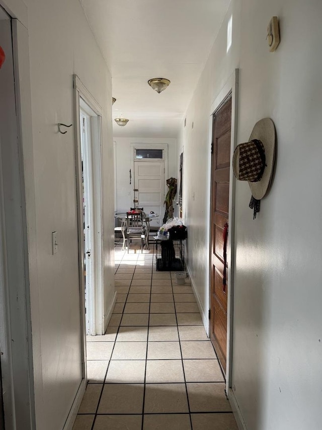 hallway featuring light tile patterned floors