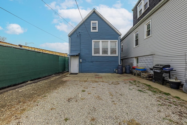 view of side of home with a patio