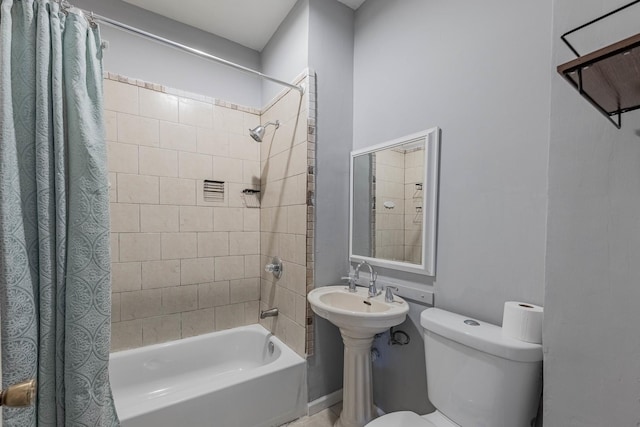 full bath featuring toilet and shower / bath combo with shower curtain