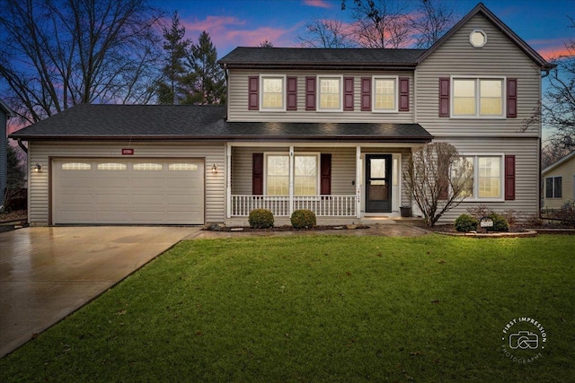 traditional-style home with a yard, covered porch, driveway, and an attached garage