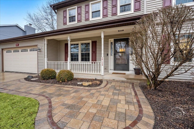 view of front facade with a porch and an attached garage