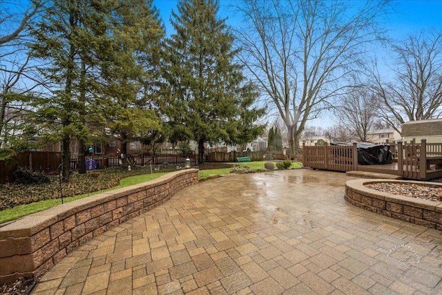 view of patio featuring fence private yard and a deck