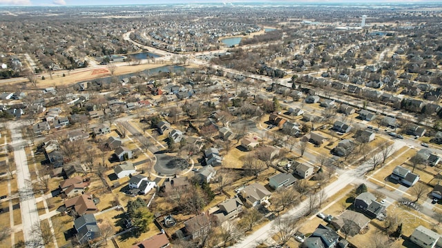 bird's eye view with a water view and a residential view