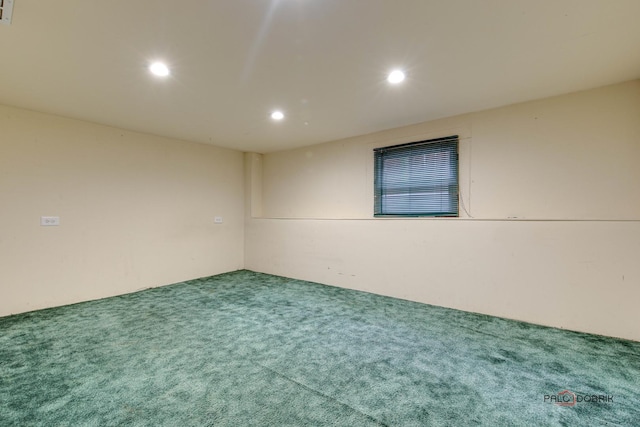 carpeted empty room featuring visible vents and recessed lighting