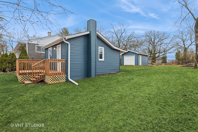 rear view of house with a deck, a garage, an outdoor structure, a lawn, and a chimney