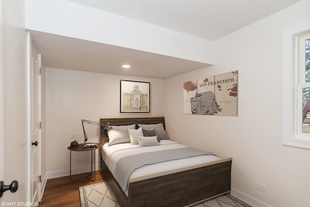 bedroom with recessed lighting, baseboards, and wood finished floors