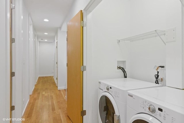 laundry room featuring laundry area, recessed lighting, light wood-style flooring, and washer and dryer