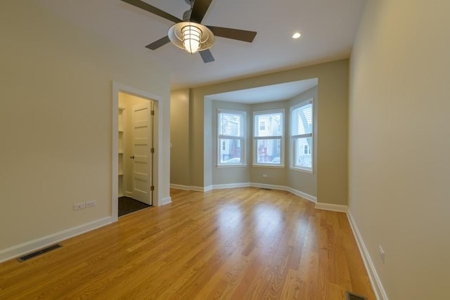 unfurnished bedroom featuring light wood finished floors, recessed lighting, visible vents, and baseboards