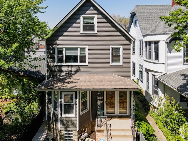 view of front of home featuring roof with shingles