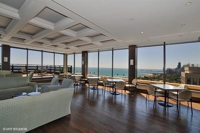 living room featuring floor to ceiling windows, coffered ceiling, wood finished floors, and beamed ceiling