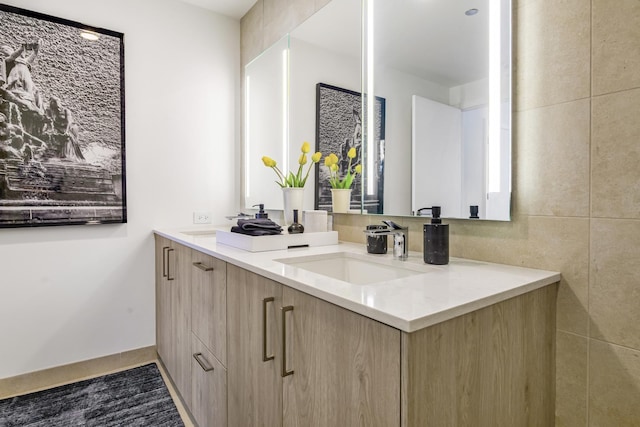 bathroom featuring double vanity and a sink