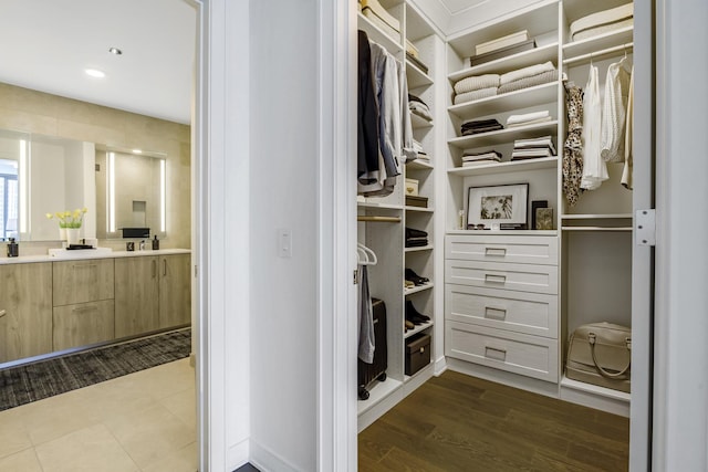 walk in closet featuring dark wood-type flooring