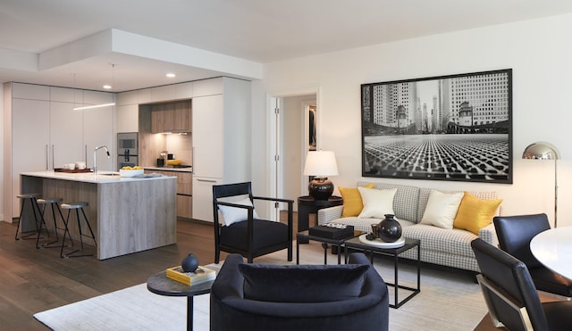 living area featuring recessed lighting and dark wood finished floors