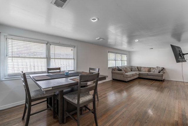 dining space with recessed lighting, visible vents, baseboards, and wood finished floors