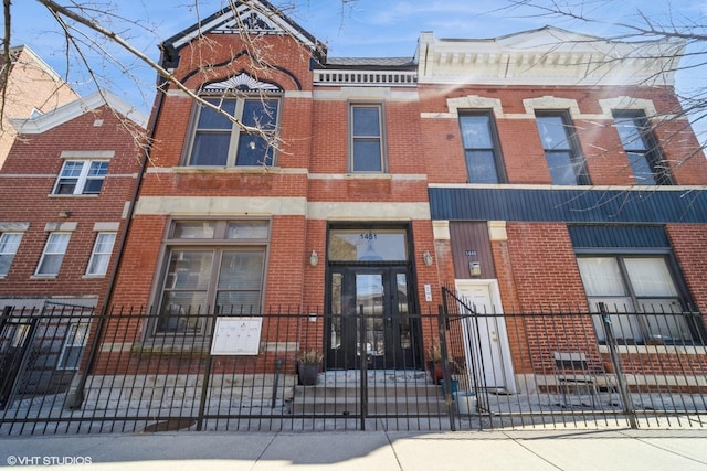 view of building exterior with fence