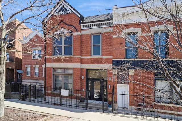 view of building exterior with fence