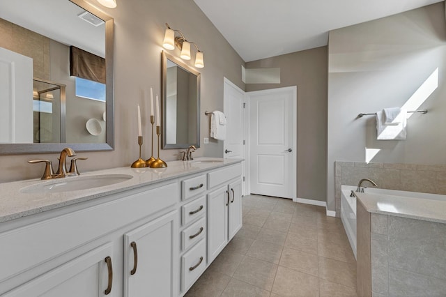 full bath featuring double vanity, a sink, visible vents, and tile patterned floors