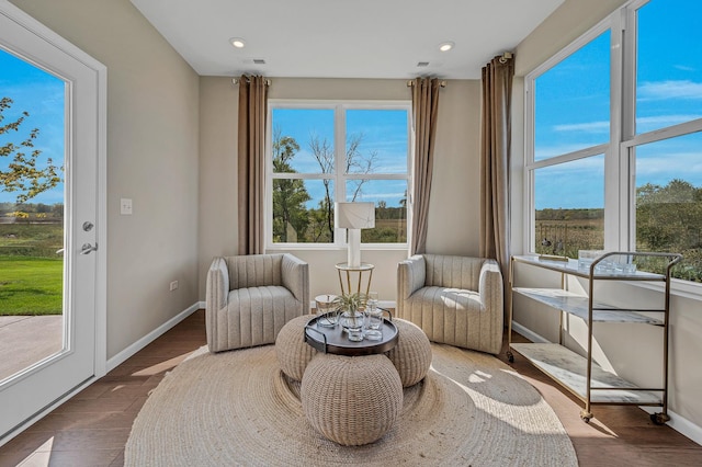 sitting room with recessed lighting, baseboards, and wood finished floors