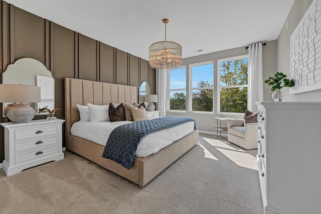 bedroom with light carpet, visible vents, and an inviting chandelier