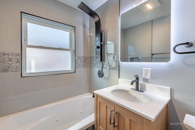 bathroom with a combined bath / shower with jetted tub and vanity