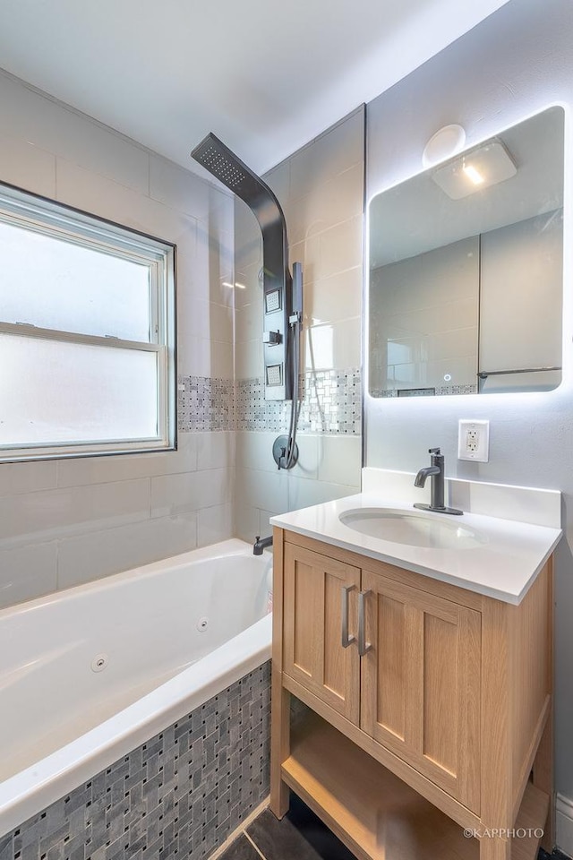 bathroom featuring a combined bath / shower with jetted tub and vanity