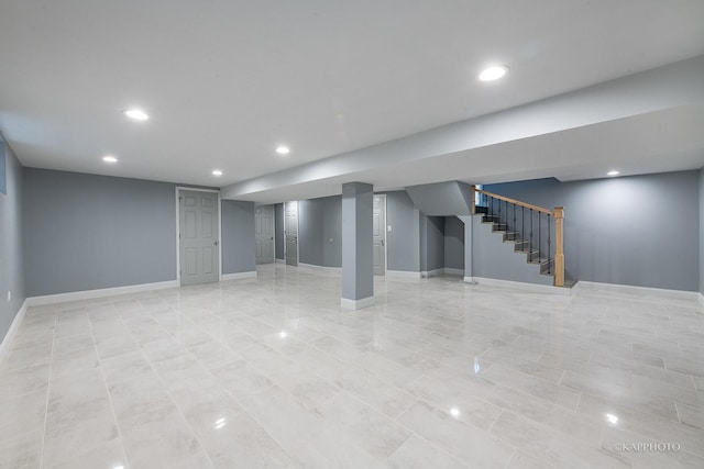 finished basement featuring recessed lighting, baseboards, and stairs