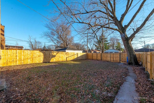 view of yard with a fenced backyard