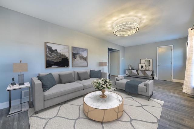 living area with wood finished floors and baseboards