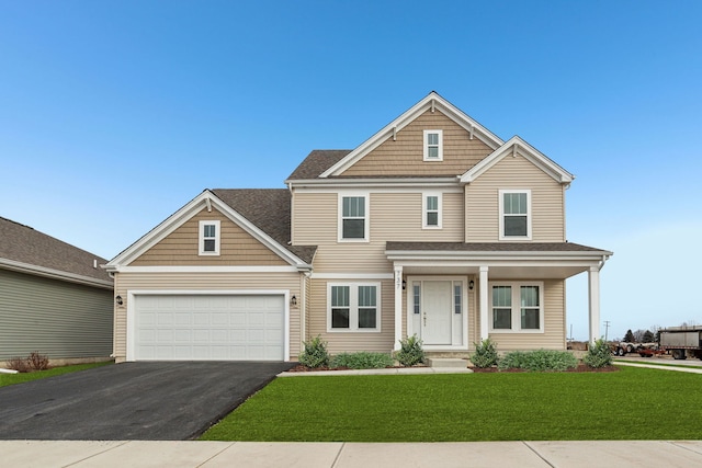 view of front of property featuring a porch, a garage, and aphalt driveway
