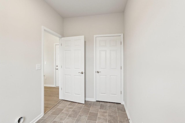 unfurnished bedroom featuring baseboards