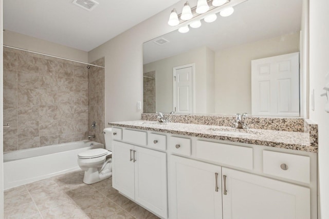 full bathroom with toilet, bathtub / shower combination, a sink, and visible vents