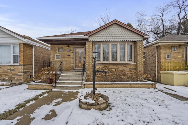 view of front of house featuring brick siding