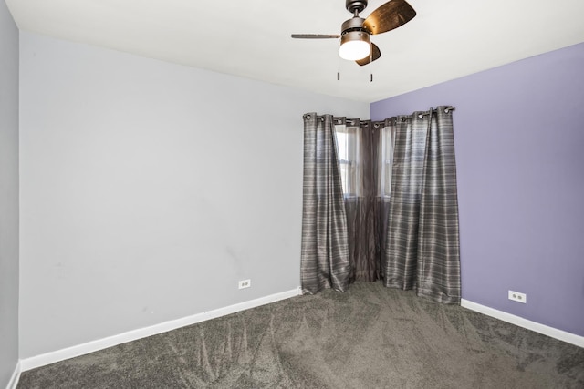 spare room featuring carpet, ceiling fan, and baseboards